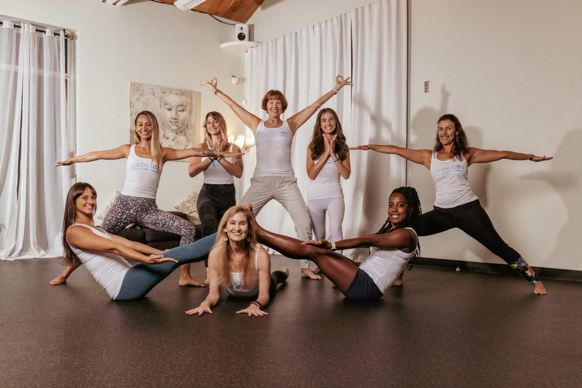 A Group Of Women Doing Yoga Poses